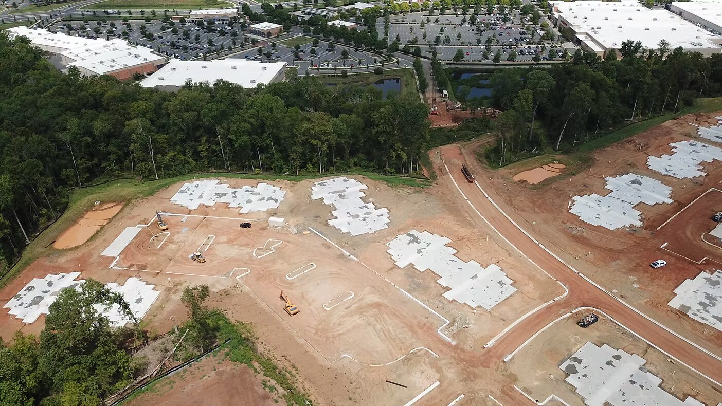 Pipe laying crew in trench